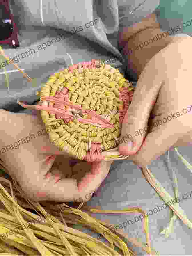 A Close Up Of A Person's Hands Weaving A Basket With Natural Fibers Cane Basket Work: A Practical Manual On Weaving Useful And Fancy Baskets