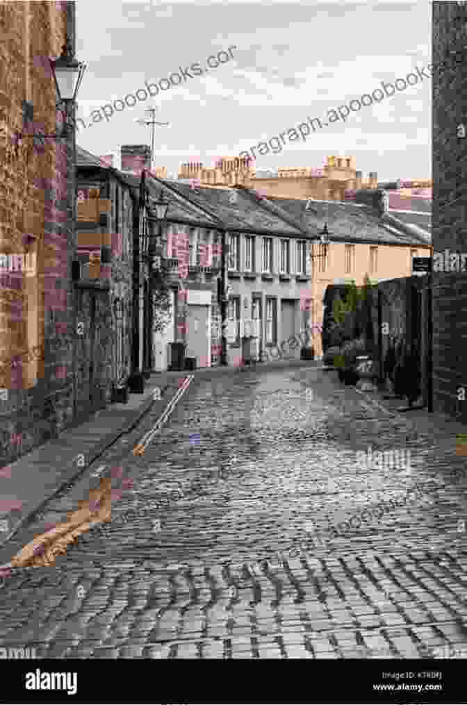 A Dimly Lit Street In Edinburgh With Cobblestones And Old Buildings Aftershock (Bob Skinner 18): A Gritty Murder Case From The Streets Of Edinburgh